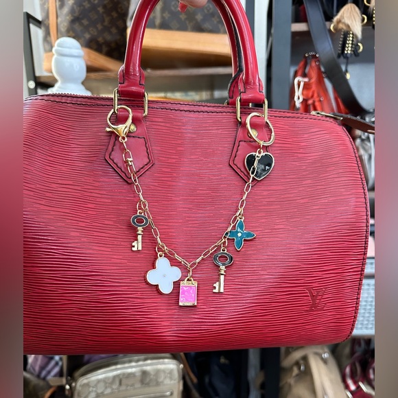 Louis Vuitton Handbags - Lv epi speedy bag w provided bag charm